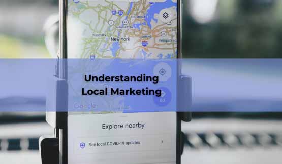 A picture of a phone with Google Maps open. The text says: Understanding Local Marketing